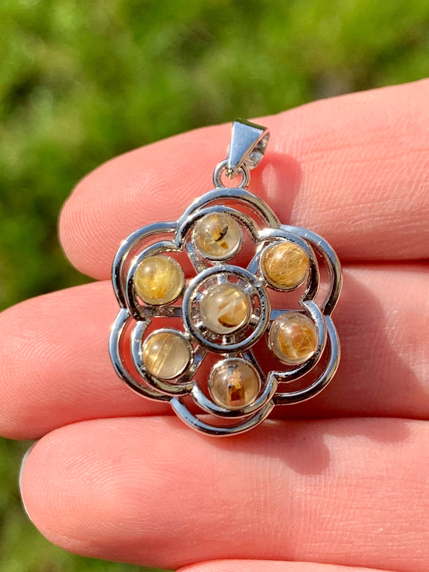 Golden rutile quartz anti-stress pendant